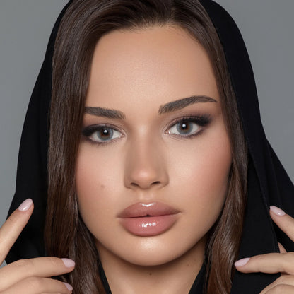 Close-up of a woman with makeup and a black hijab wearing Bella colored contact lenses named Silent Gray