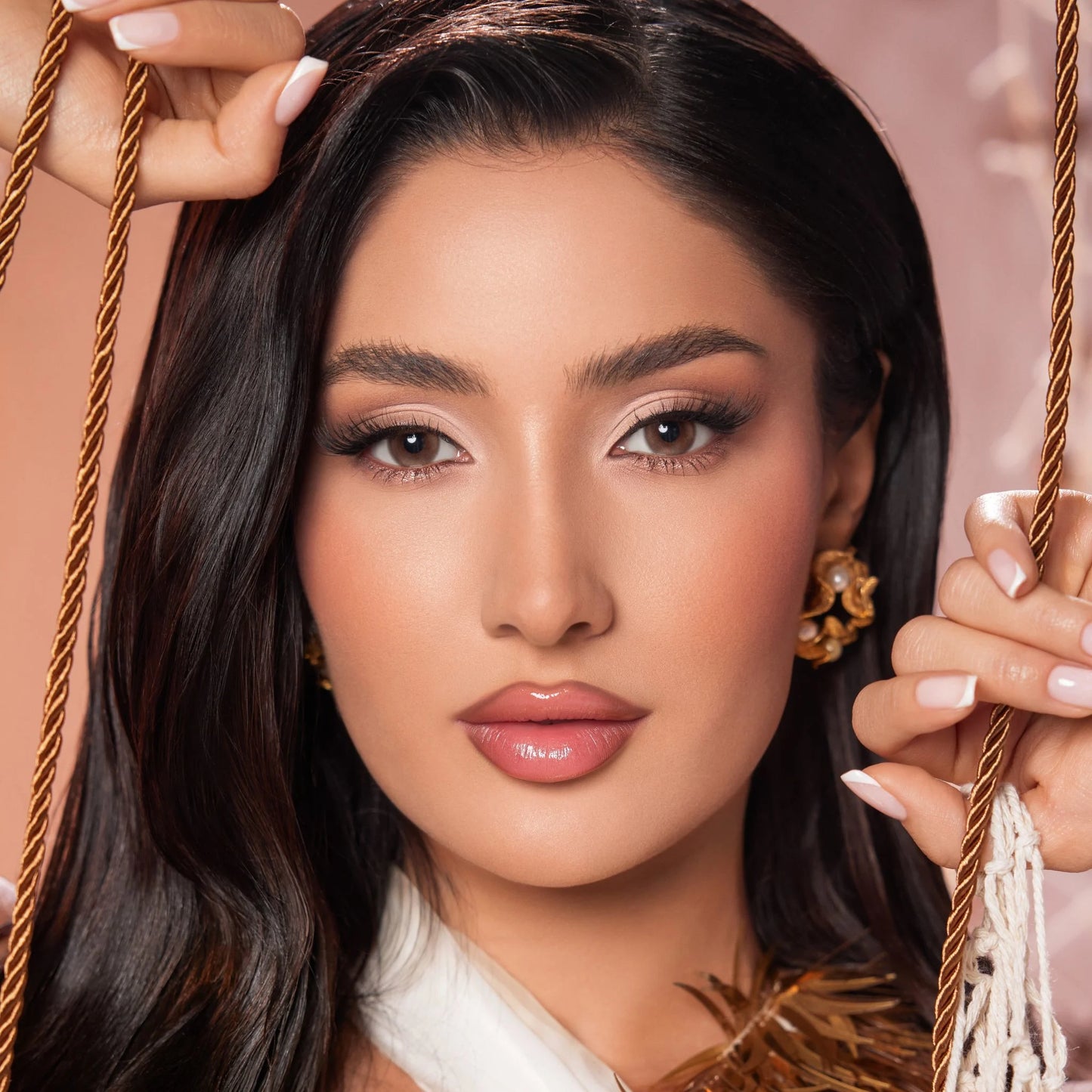 Close-up of a woman with makeup wearing Bella colored contact lenses named Siren Bronze